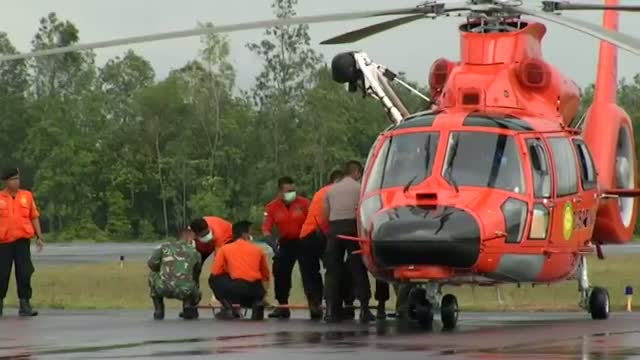 Watch More AirAsia Bodies Brought to Land Video Video