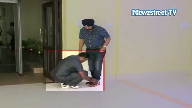 Watch Mamata's minister made security person tie shoe laces Video