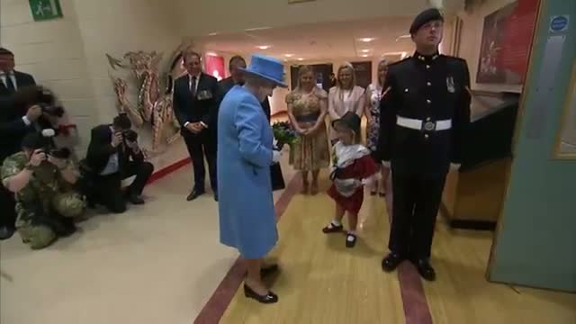 Watch Soldier Bumps Off Girl's Hat on Royal Visit Video