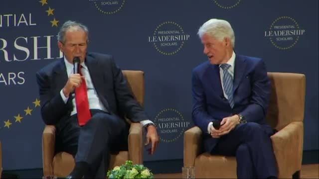 Watch Presidents Bush, Clinton Swap Stories in Dallas Video