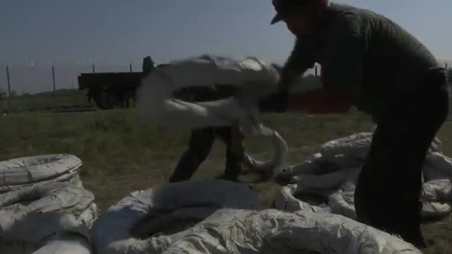 Watch Razor Wire Goes Up at Hungary-Serbia Border Video