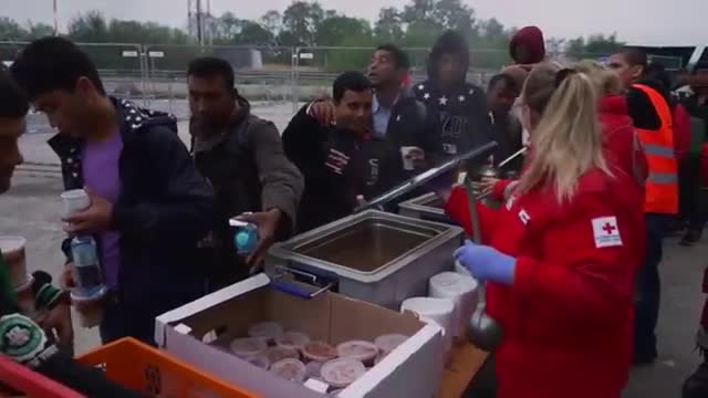 Watch Red Cross Provides Food, Water For Migrants Video