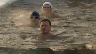 Watch Russian 'Seals' Take Icy Christmas Plunge Video