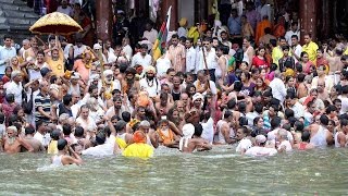 Watch Makar Sankranti: Thousand take dip in Ganga during Ardh Kumbh mela Video