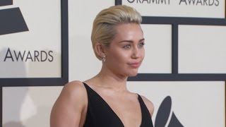 Watch Miley Cyrus Flaunts Familiar Bling Video