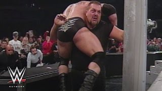 Watch WWE Network: Big Show chokeslams Brock Lesnar through the announce table Video