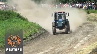 Watch Farm tractors power through Russian race course Video
