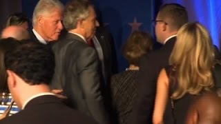 Watch Clinton, Bush, Blair Evacuate Due to Storm Video