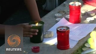 Watch Mourners lay flowers, light candles for Nice victims Video