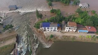 Watch Ferocious mountain floods crash down onto China village Video