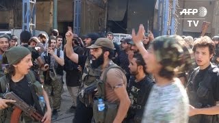 Watch Armed groups push back against regime forces in besieged Aleppo Video