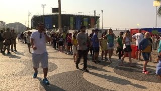 Watch Fans still in high spirits despite long lines, food shortages Video