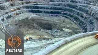 Watch BHP Billiton looks beyond record loss Video