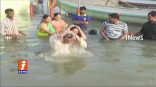 Watch AP Deputy CM Chinna Rajappa Takes Holy Dip in Amaravathi | Krishna Pushkaralu | iNews Video