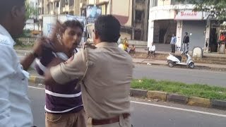Watch Traffic Police caught assaulting young man in public Video