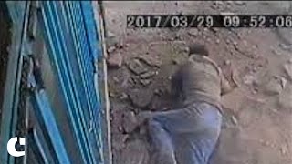 Watch Sewer hole blows up in man's face as he drops cigarette butt in it in Tehran, Iran Video