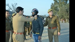 Watch J&K police distributes helmet to bikers riding without it Video