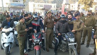 Watch Police distributes helmets among bikers Video