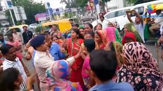Watch Viral Video of Ahmedabad Police Officer hitting women Video