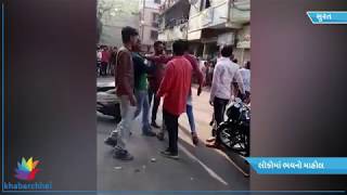 Watch Viral video of uproar of ladydon on road with weapons in Surat Video