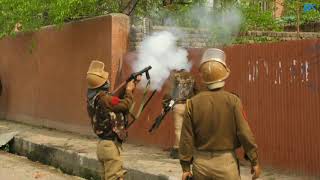 Watch Protesting students torch police picket during clashes near Bakshi stadium in Srinagar Video