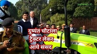 Watch Dushyant Chautala reach parliament in tractor Video