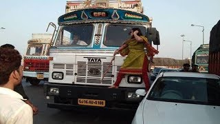 Watch Bharuch: Woman thrashing truck driver on National highway Video