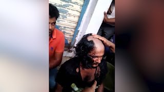 Watch People shaved the robbers head because of police inactivity in Surat Video
