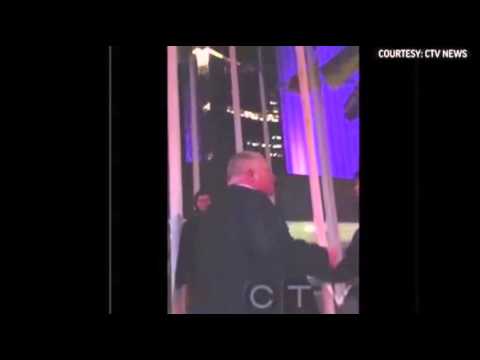 Watch Mayor Rob Ford stumbling outside Toronto's City Hall and swearing loudly Video