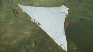 Watch Possible MH370 debris going to Malaysia for examination Video