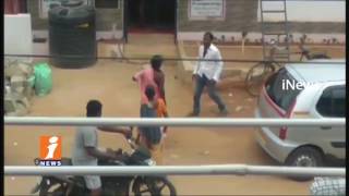 Watch Husband Brutally Beats Wife on Road at Sripuram Circle | Nagarkurnool iNews Video