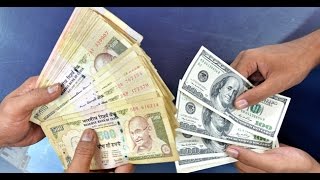 Watch Rupee inches up 8 paise against dollar Video