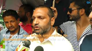 Watch Protesters use black umbrellas to demonstrate against article 35-A 'abrogation' Video