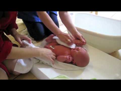 Watch Baby BATH bathing newborn baby - How to bathe a newborn baby- an expert Midwife tutorial Video