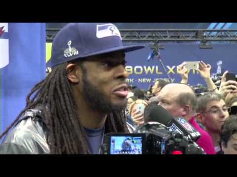 Watch Sherman, Manning Take Center Stage at Media Day News Video Video