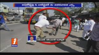 Watch Traffic SI Lingamurthy Beats Lorry Driver on Road in Rajanna Sircilla District | iNews Video